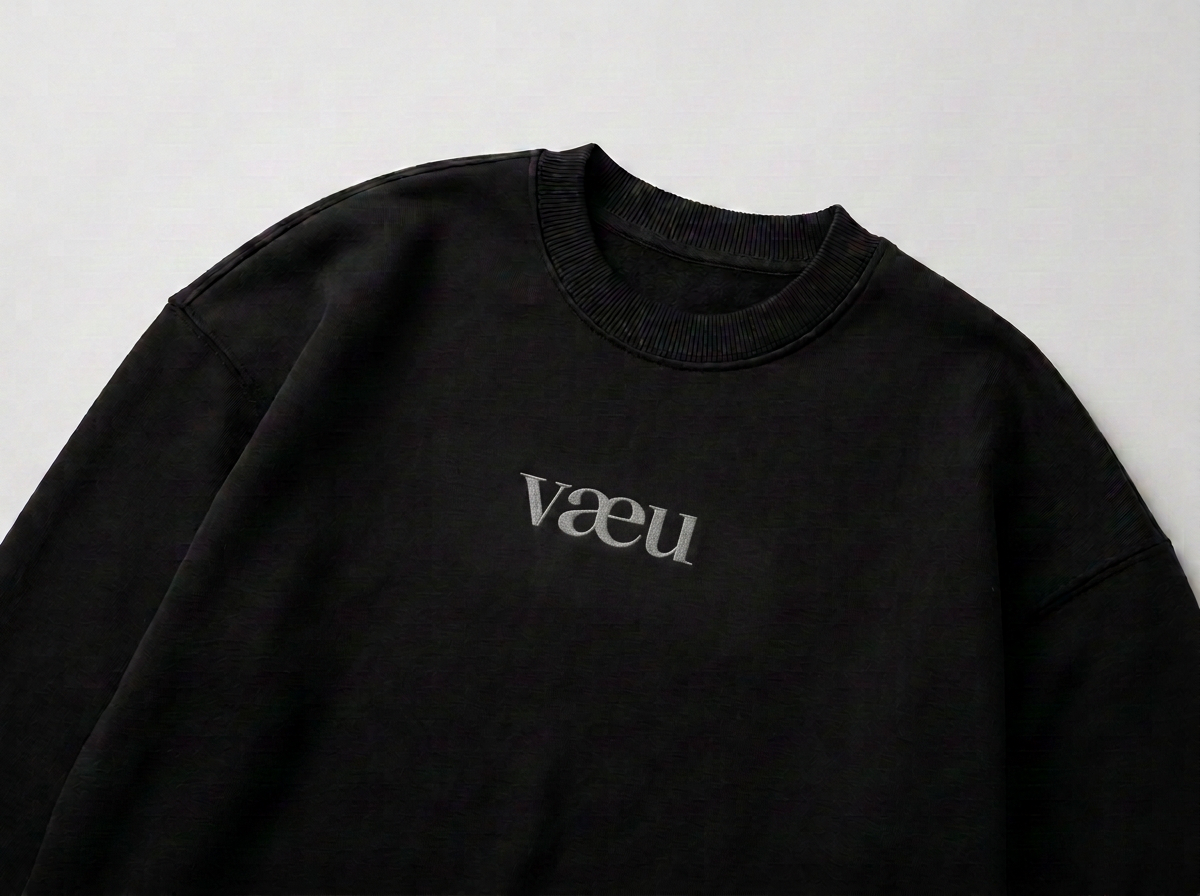 vaeu No. 02 sweatshirt in black with connected vaeu wordmark logo